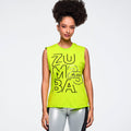 Woman wearing a bright green Zumba tank top on a plain background
