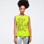 Woman wearing a bright green Zumba tank top on a plain background